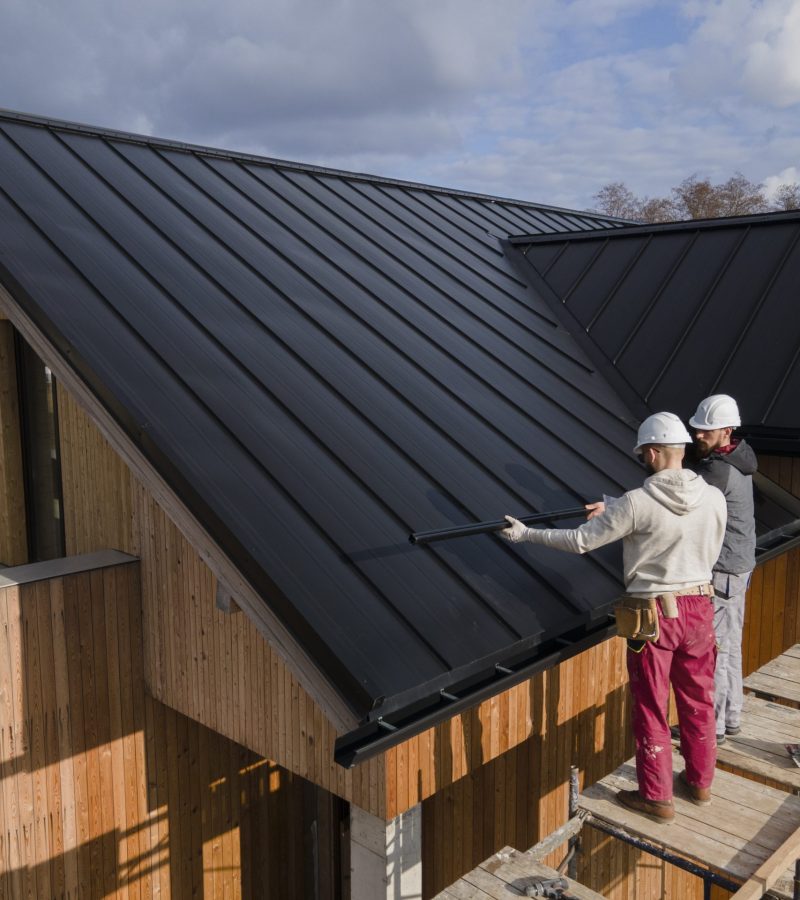 full-shot-roofers-working-together-with-helmets-scaled.jpg
